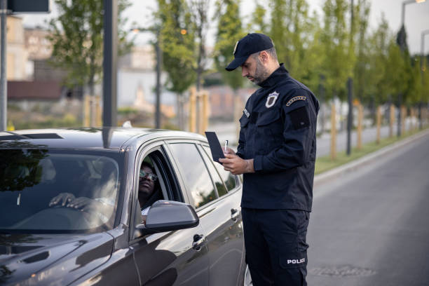 istock Middle aged Caucasian male police officer at work 1321018059