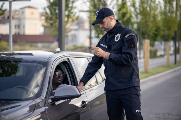 istock Middle aged Caucasian male police officer at work 1321018077