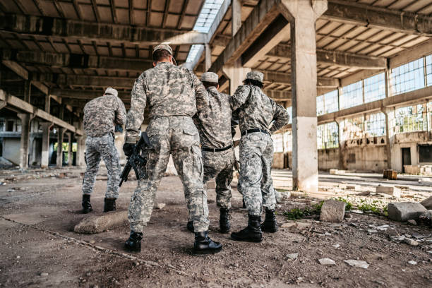 istock Military assault team extracting wounded soldier 1321018861