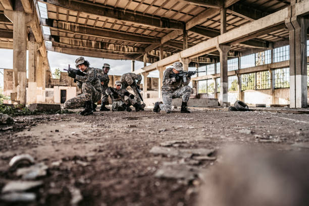 istock Military assault team extracting wounded soldier 1321018893
