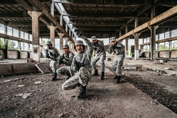 istock Military assault team charging in battle 1321018927