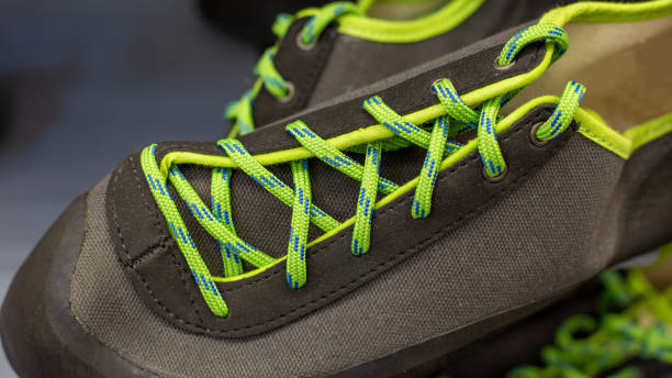 istock black climbing shoes with yellow-green laces 1321018948