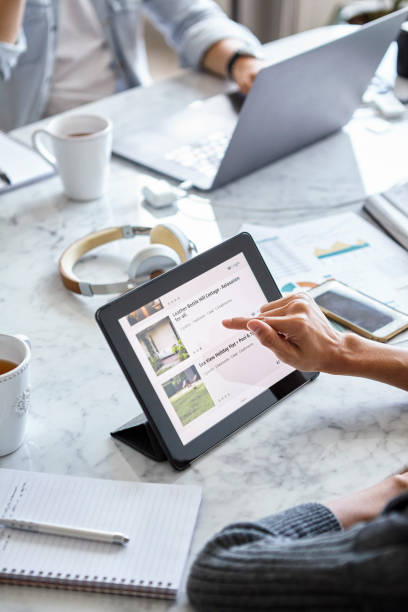 istock High angle view of young adult woman using touchscreen device during daytime 1321019107