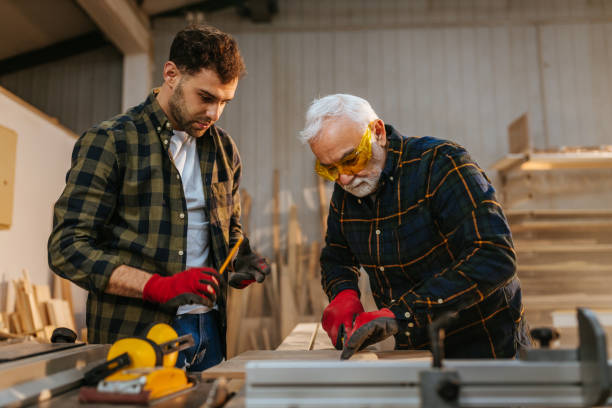 istock Father helping out his son in the workshop 1321019804