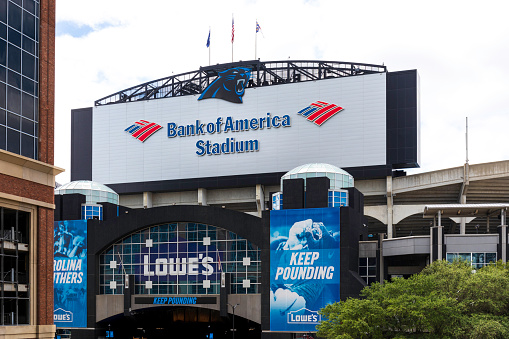 Charlotte, NC, USA-30 May 2021: Sign and logo at rear entrance to the Carolina Panthers Bank of America Stadium. Also, Lowe's signs.