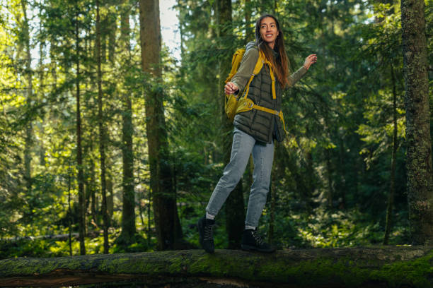 istock Young woman hiking and going camping in nature 1321022085