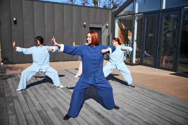 istock Gladsome people training for martial arts outside 1321026140