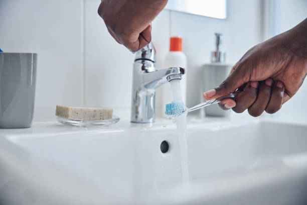 istock Close up of man that watering toothbrush 1321027106