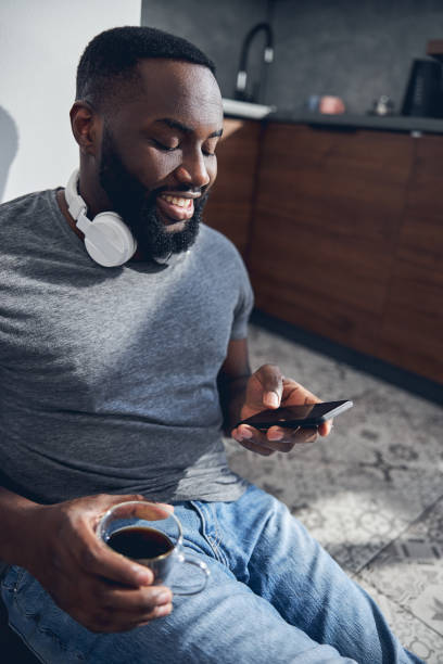 istock Close up of delighted male that reading message 1321027109