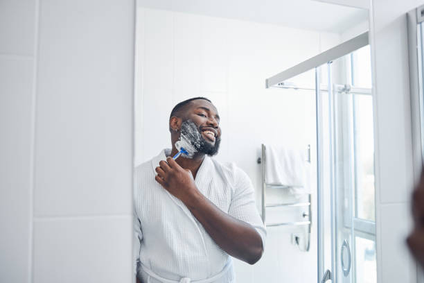 istock Handsome young brunette male looking at the mirror 1321027145