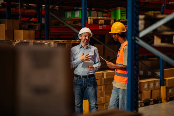 istock Warehouse staff meeting, worker with manger 1321028118