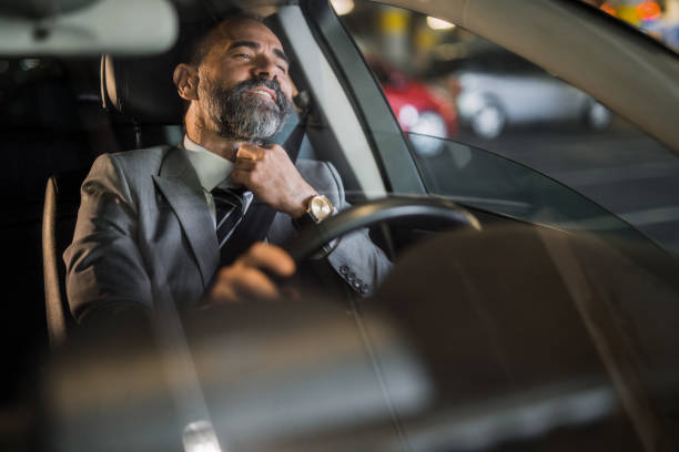 istock Businessman driving a car. 1321029042