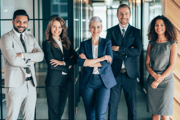 Portrait of Business team Portrait of Mixed age range and multi ethnic business team looking at camera in the office organized group photos stock pictures, royalty-free photos & images
