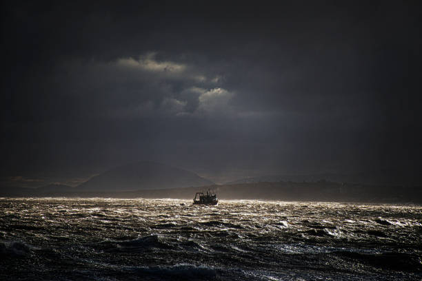 Ship in storm where the Río de la Plata ends. In the background you can see the Pan de Azucar hill in the city of Piriapolis