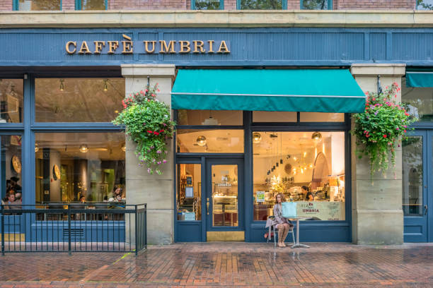 Boston, MA, July 2, 2017: Boston street scene including Polcari's coffee, a historic small business opened in 1932. Boston has both modern and historical buildings in its downtown area.