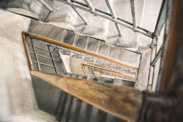istock Old spiral staircase with wooden railing 1321030594
