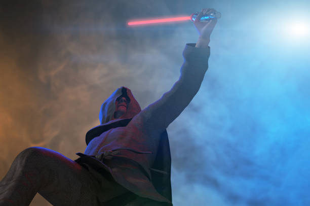 istock a man holds a laser lightsaber in his hands render 3d 1321032044