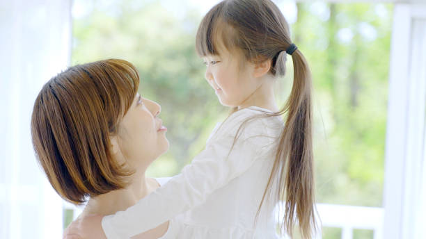 istock young asian mother and daughter 1321038347