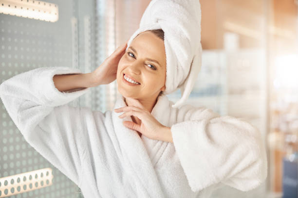 istock Contented woman touching her face with her hands 1321040025