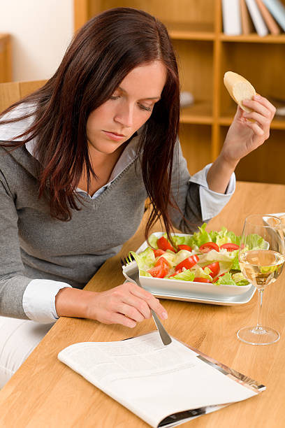 istock Healthy lunch at home woman read magazine 132104021