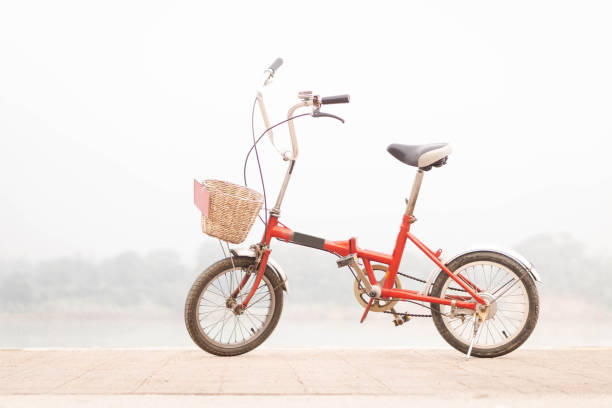 istock Red bicycle parked on the riverside on nature background. 1321040679