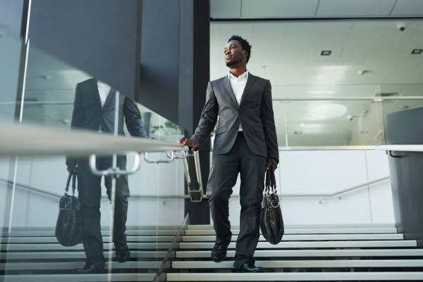 Successful African American Businessman Walking in Office Lobby