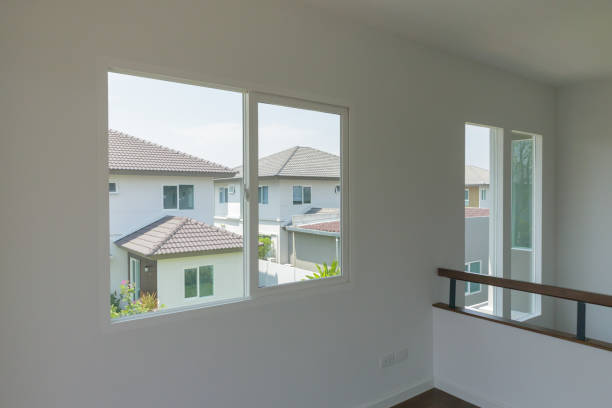 istock Empty room with glass window frame house interior on concrete wall 1321043299