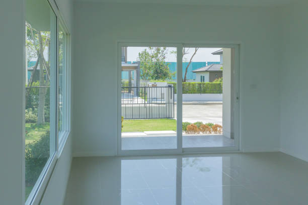 istock Empty room with glass window frame house interior on concrete wall 1321043303