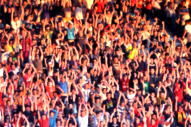 istock Blurred crowd of spectators in a stadium 1321043430