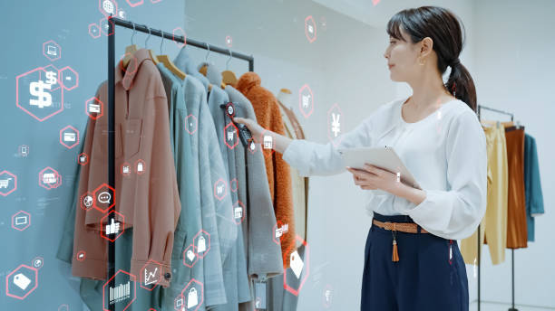 Woman scanning products with a smart phone. Retail as a Service. RaaS. Woman scanning products with a smart phone. Retail as a Service. RaaS. point of sale tablet stock pictures, royalty-free photos & images