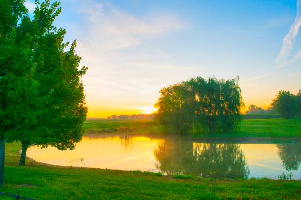istock Sunrise-reflection in a farm pond-Miami County Indiana 1321051381