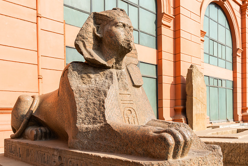 01.31.2018. Cairo, Egypt. A sculpture of a sphinx in front of the entrance to the Egyptian National Museum - the world's largest repository of ancient Egyptian art, located in Cairo on Tahrir Square.