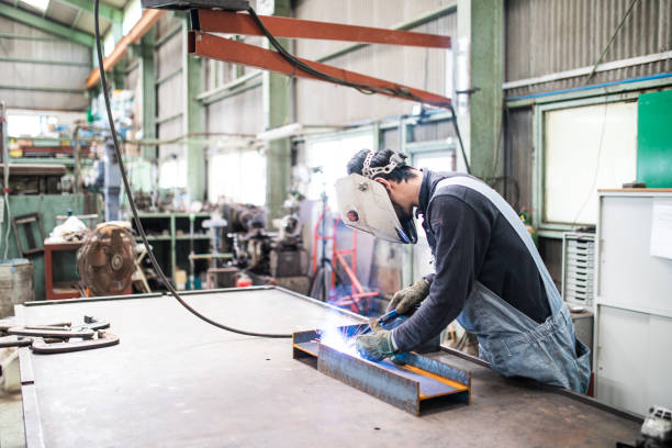 istock Japanese steel factory worker man welding 1321063544