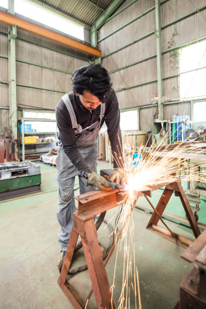 istock A Japanese metal worker man using a plasma cutter in factory 1321063772