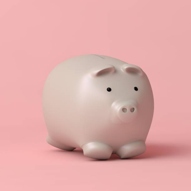 istock White piggy bank on pink background 1321063919