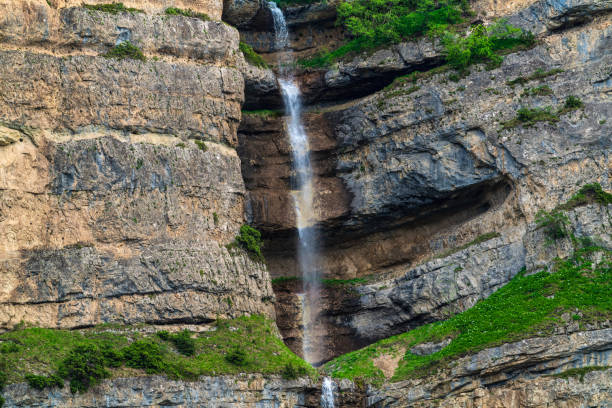istock Beautiful high waterfall in the mountains 1321065040