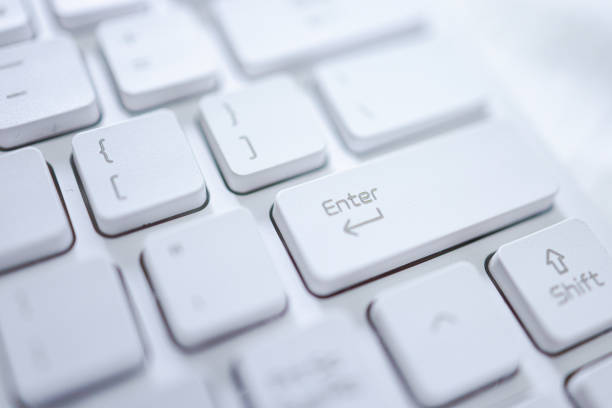 istock Hands of business woman Pressing enter button on computer keyboard 1321066559