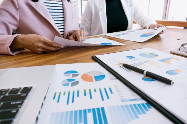 istock Team leader coach teach young workers explain on paper for business plan listen talkative coworker and discussing new project presentation Serious professional advisor consulting 1321067691