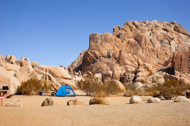 A view of a camping tent set up in a campground seen inside Joshua Tree National Park.