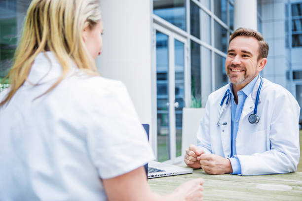 istock Two doctors on a medical campus 1321070070