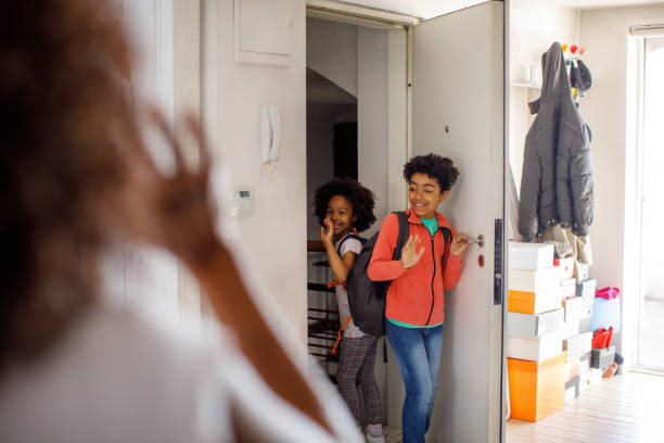 istock Excited Children Returning Home From School 1321072519