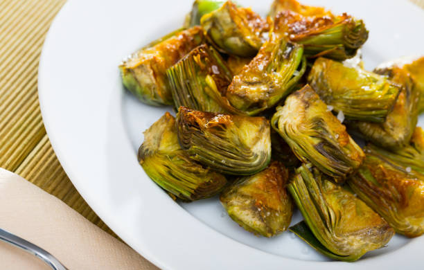 istock Artichokes fried in oil 1321073497