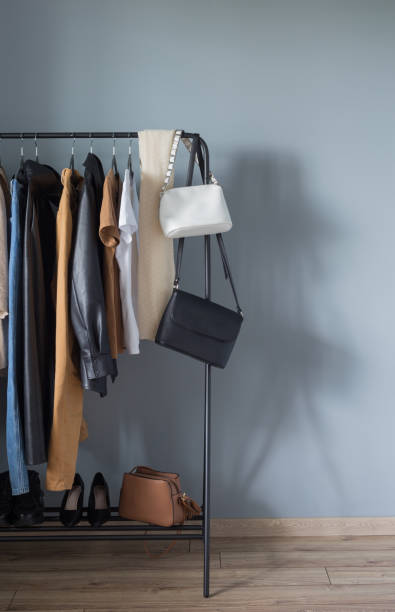 istock basic women's autumn wardrobe with shoes and handbags on  hanger 1321074441