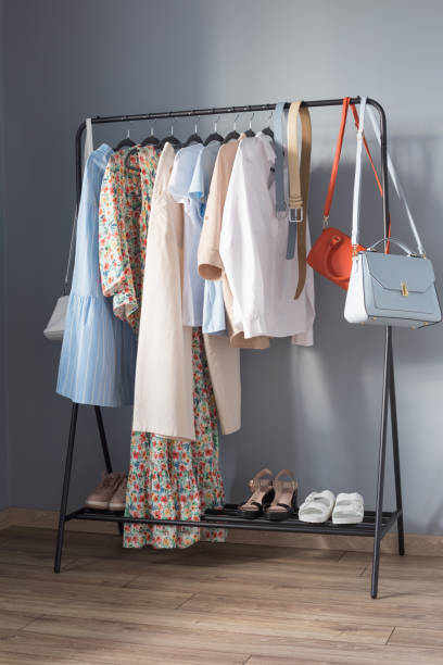 istock light colored womens summer clothes and shoes on  hanger 1321074449