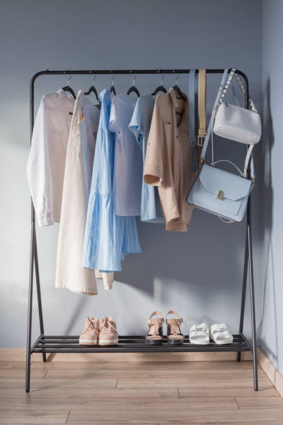 istock light colored womens summer clothes and shoes on  hanger 1321074456