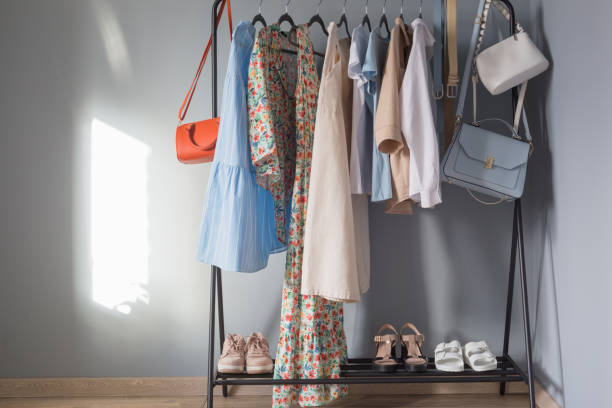 istock light colored womens summer clothes and shoes on  hanger 1321074457