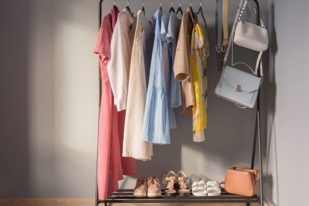 istock light colored womens summer clothes and shoes on  hanger 1321074463