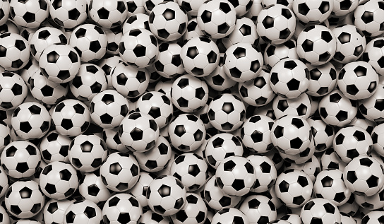 Heap of classic black and white soccer balls, 3D rendering illustration.