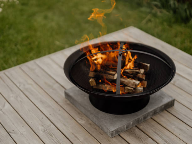 istock Fire barrel fire pit fireplace in iron on porch in summer 1321075666