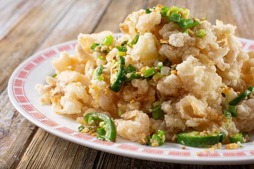 A view of a plate of Chinese style deep fried squid.